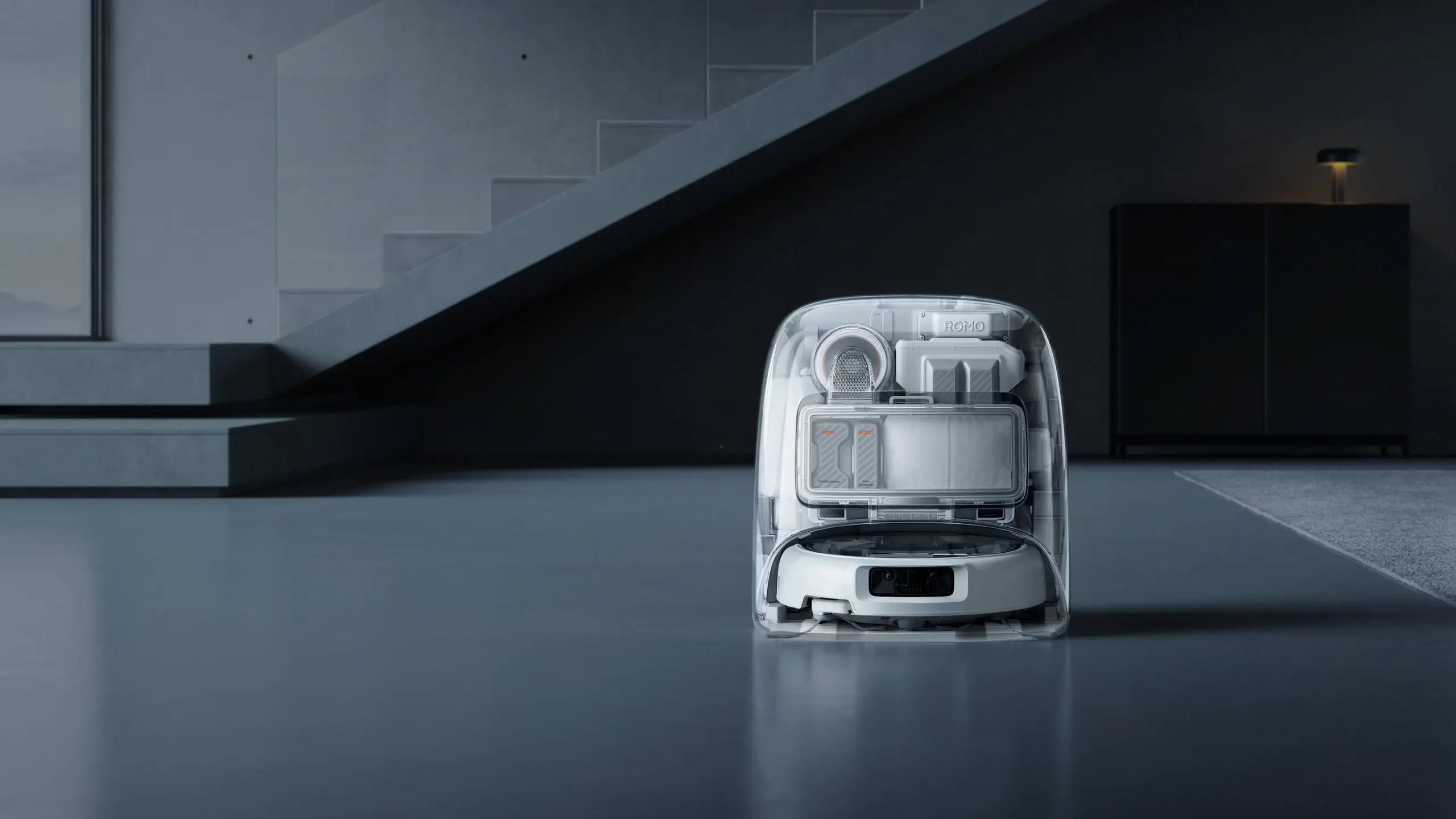 DJI ROMO robot vacuum and self-cleaning dock in a modern living room